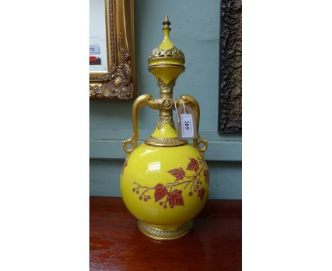 Most decorative late Victorian yellow and gilt lidded oil vessel (some repair) on separate black circular plinth from the Wor