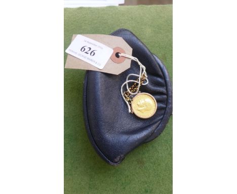 Blue leather purse and a King George V sovereign with plated surround and small chain 
