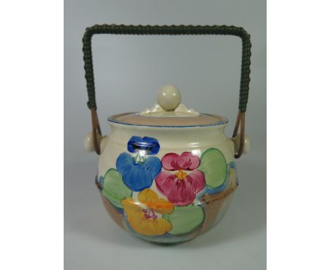 A Clarice Cliff Bizarre Biscuit Barrel with swing handle (slight chip to inner rim)