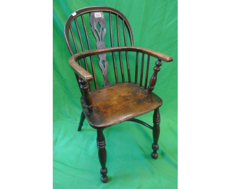 Antique elm seated stick back armchair with crinoline stretcher