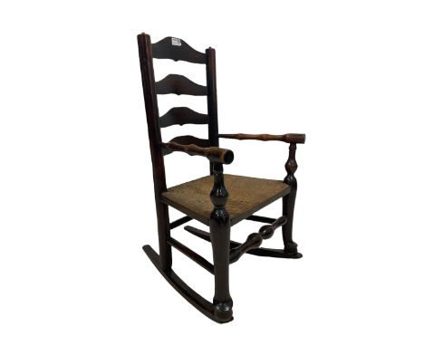 19th century childs rocking chair, the ladder back over rush seat 