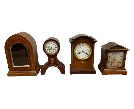 Three Edwardian mantle clocks and one Edwardian clock case