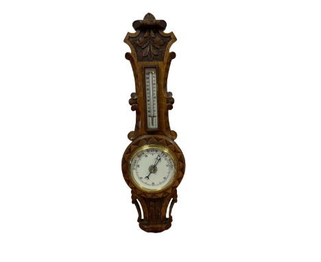 Carved oak aneroid barometer