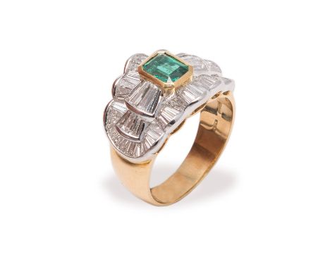 Emerald and diamond ring. White gold ring with emerald, weighing approx 0.90 carats, within a sorround of taper diamonds, siz