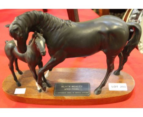 Black Beauty and foal Connoisseur model by Beswick on wooden plinth