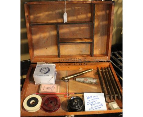 A wooden tackle box containing a boxed Craddock-Astwood Flo 151 fly reel and other accessories