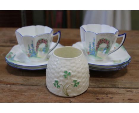 A Belleek honey pot, together with two Shelley cups, and five Shelley saucers