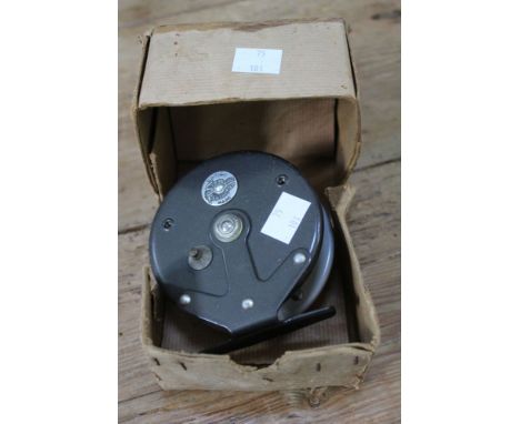 A vintage "Strike Right Feather Flow" fly reel in box