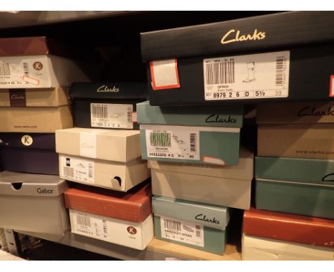 Shelf of ladies shoes mainly Clarks sizes 5 1/2 to 6 and boots 