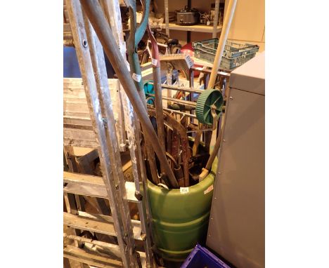 Green tub of garden tools 