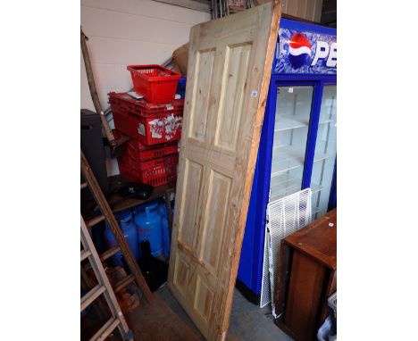 Three six panel pine doors in original plastic wrap CONDITION REPORT: This has never been hung.