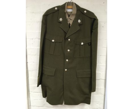A territorial army uniform, cap and belt.