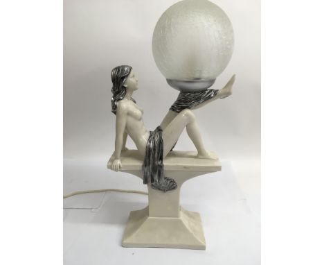 An Art Deco style figural side lamp depicting a girl in a classical pose, the lamp having a frosted glass shade, approx 48cm.