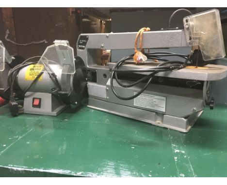 A bench top grinder and a 16” table scroll saw (both untested)