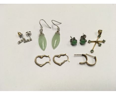 Two pairs of jade earrings a gold pendent and other Gold earrings.