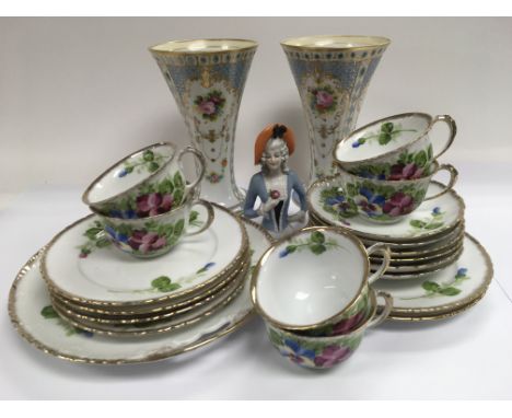 A pair of trumpet shaped Noritake vases, ceramic pin doll and a tea set decorated with flowers.