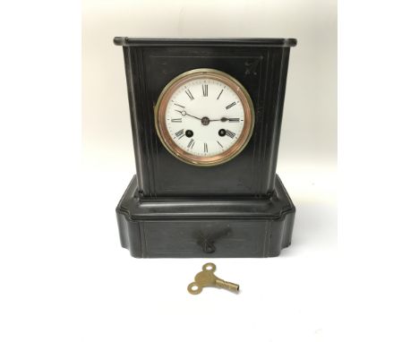 A black slate mantel clock with a French movement striking on a bell.