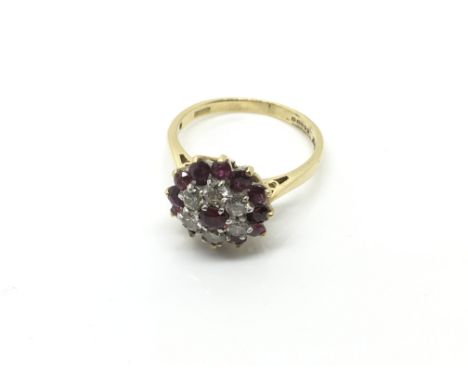  A Ladies ruby and diamond Cluster ring. Ring size M. 
