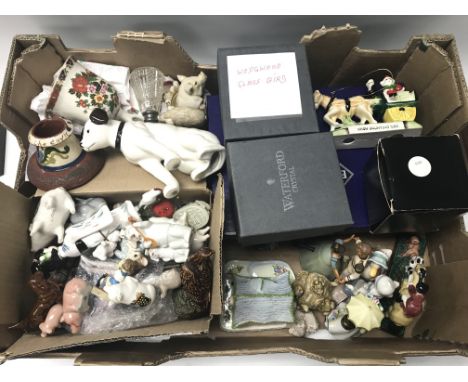 A collection of various ceramic figurines along with some glass.