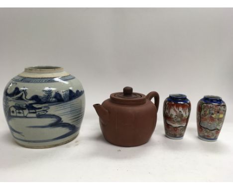 A collection of oriental items to include a Chinese ginger jar, a terracotta teapot and two vases
