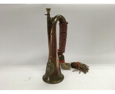 A copper and brass military bugle belonging to the Argyll and Sutherland highlanders