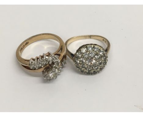 A 9 ct gold cluster ring and one other ring marked 18 k