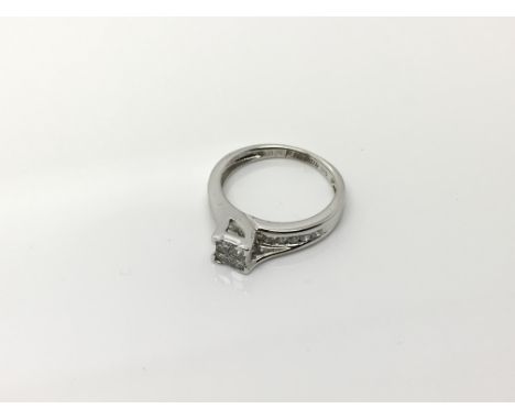 A modern design 10ct white gold ring set with diamonds approx 0.5ct. Ring size K. 