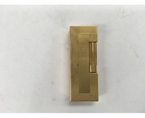 A gold plated Dunhill lighter in the original box