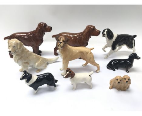 A collection of 9 Beswick, Doulton and Copenhagen ceramic dogs.