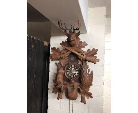 A modern Cuckoo clock with forest animal decoration