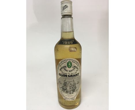 A rare bottle of distilled 1969 Glen Grant 5 year Malt Scotch Whisky. Good level.