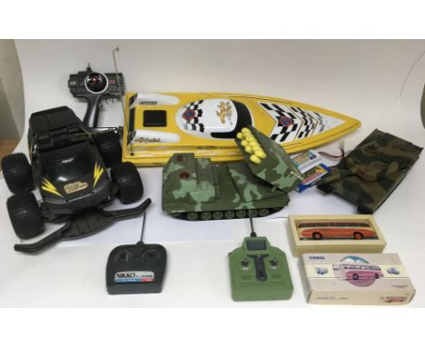 A group of  remote control toys including a large speedboat and a Jeep plus a boxed Corgi bus