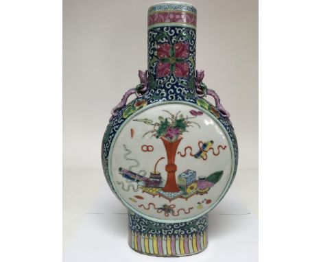 A large Chinese moon vase having two reserve panels painted with scholastic items on blue ground and applied dragons to neck.