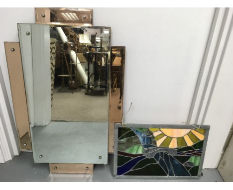 An Art Deco style rectangular wall mirror and a stained glass panel