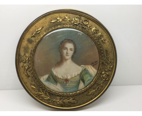 A 19th century French style portrait of a young woman, signed Auvry?, vellum backed mounted in gilt frame.Approx 12.3cm