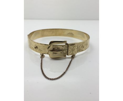 A gold and jade bangle marked 14K. Weight approx 10g.