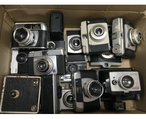 A box containing a collection of vintage cameras to include Kodak and Polaroid examples