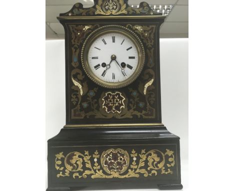 A French mantle clock brass inland the enamel dial with Roman numerals