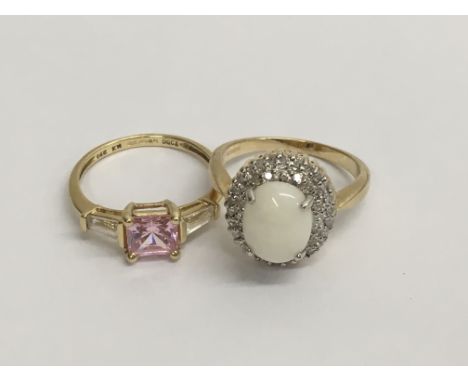 A 14 k gem stone ring and a 9 ct gold ring inset with a opal ring