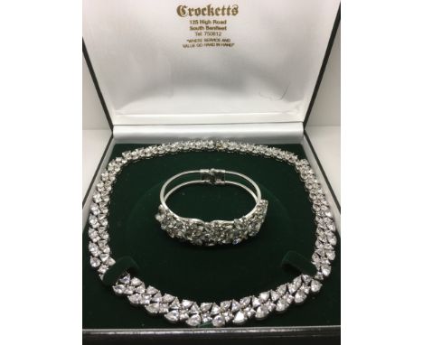 A vintage style silver and diamanté collar necklace with conforming bangle