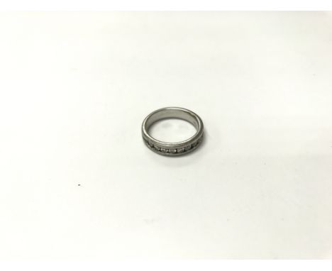 A platinum and diamond (GIA scale colour G) ring. Size approx J, weight approx 7.5g