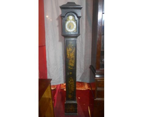 An 18th century ebonised longcase clock, anchor escapement, the silvered brass broken arch dial with Roman and Arabic numeral