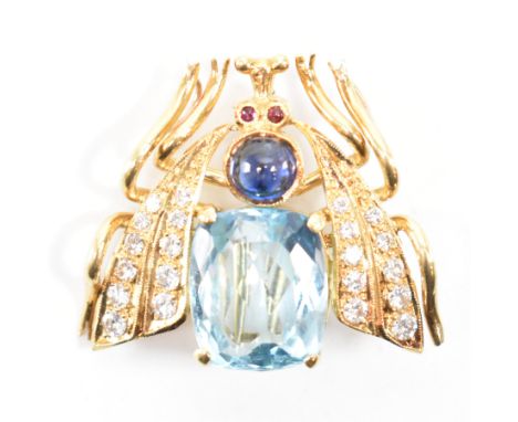 An 18ct&nbsp; gold gem set bug brooch pendant . The brooch in the form of a bee having a cushion cut topaz and sapphire caboc