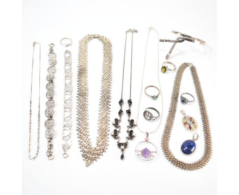 A selection of silver and white metal jewellery. The lot to include a silver bangle bracelet (marked 925), a silver heart bra