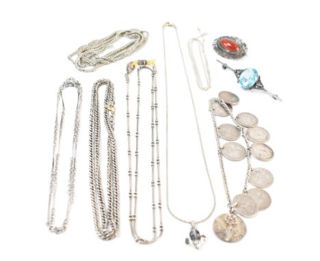 A collection of silver and white metal jewellery. The lot to include an antique silver coin bracelet, a silver necklace chain