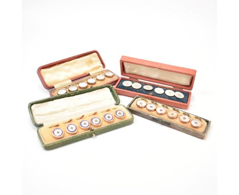 A collection of four early 20th Century boxed mother of pearl dress buttons sets. The sets each include six mother of pearl s