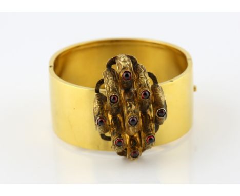 Victorian gold oval hinged bangle, and ornate garnet set centre piece, which converts to brooch, with pin and hook fitting, c