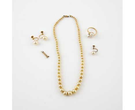 Double pearl twist ring, two white round pearls measuring approximately 7.4mm in diameter, mounted in yellow metal testing as