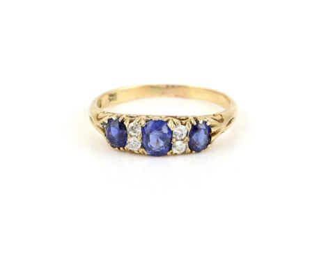 Victorian Cornflower blue sapphire and diamond ring, estimate total sapphire weight 0.97 carats, set with four old cut diamon