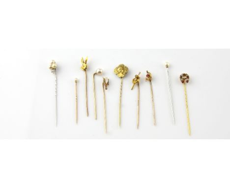  A group of antique stick pins, one three leaf clover with pearl and diamond, another single pearl, both testing as platinum,